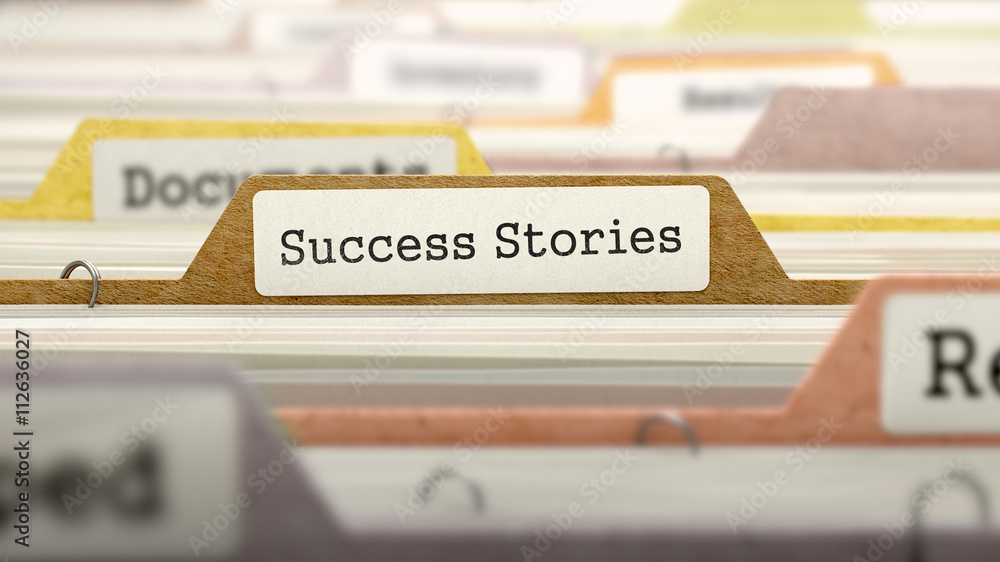 Poster success stories concept on folder register in multicolor card index. closeup view. selective focus. 