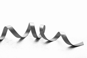 Grey ribbon on light textured background
