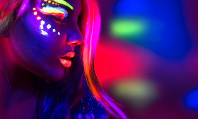 Fashion model woman in neon light, portrait of beautiful model girl with fluorescent make-up - obrazy, fototapety, plakaty
