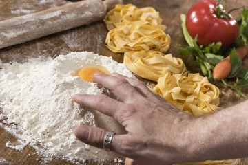 fresh homemade fettuccine on the kitchen table. Italian food