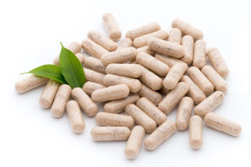 Ginkgo biloba capsule on the white background.