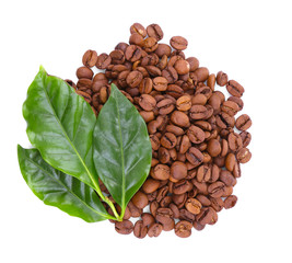 Coffee beans and green leaves, isolated on white