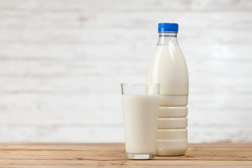 Milk bottle on wooden table