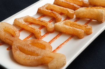 French fries with the form of musical notes and treble clef