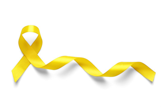 Yellow awareness ribbon on light background