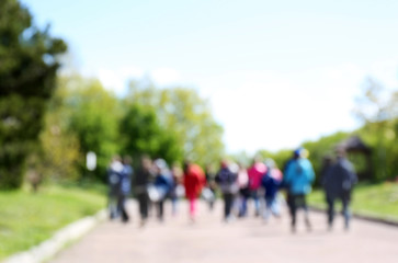 People walking in the park, unfocused