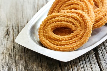 Murukku - Crunchy savory iondian snack, selective focus