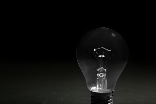 Electric bulbs on dark grey background