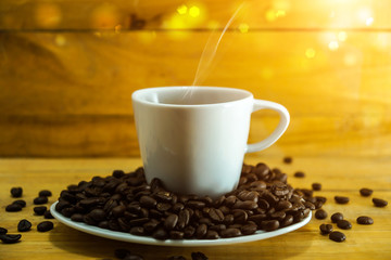 Coffee cup and saucer on a wood.