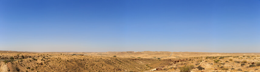 Fototapeta na wymiar Big panorama of mountains in Negev desert with road