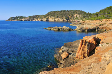 Obraz premium a view of the Mediterranean Sea and a cliffy landscape of the northeastern coast of Ibiza Island, in the Balearic Islands, Spain