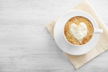 Cup of fresh coffee on napkin