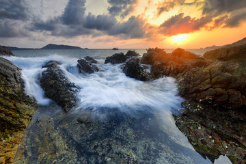 Amazing seascape during sunset with slow shutter technique  at Kalim Beach, Phuket Thailand.