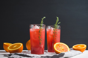 Cocktail made of Sicilian orange on the rustic wooden background