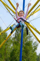girl jumping on the trampoline