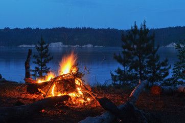 Night bonfire on the river