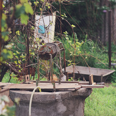 Image of an old well and a rural life.