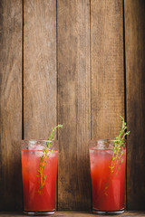 Cocktail made of Sicilian orange on the rustic wooden background