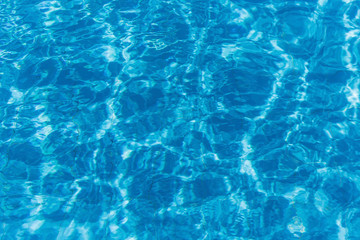 Hotel swimming pool with sunny reflections