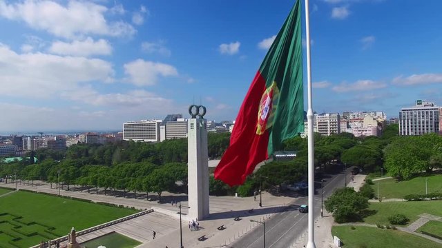 Portuguese Waving Flag in Eduardo VII Park in Lisbon, Portugal aerial view