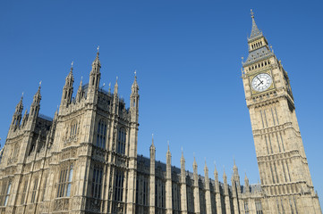 Fototapeta na wymiar The Houses of Parliament at Westminster Palace and Big Ben shine in bright morning sun in London, UK