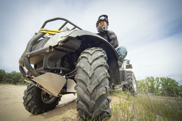 Racing ATV is sand.