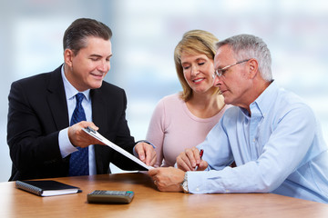Senior couple with insurance agent.