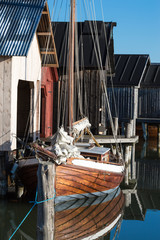 Old sailboat at boat house