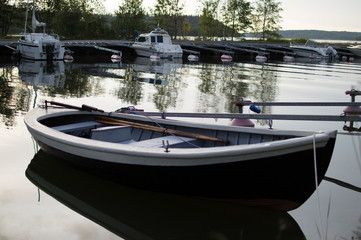 Fototapeta na wymiar open boat in Scandinavian midsummer night