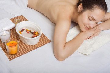 Obraz na płótnie Canvas Relaxed adult girl before spa treatment