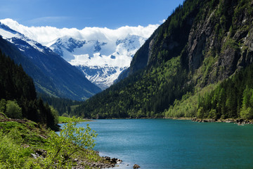 Fototapeta na wymiar Mountain lake landscape in the Stilluptal. Austria, Tyrol.