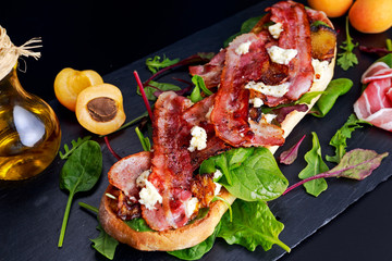 Grilled summer chiabatta with caramelized apricots, bacon, mozzarella, green salad