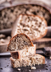 Bread. Fresh bread. Homemade traditional bread. Sliced bread crumbs knife and cumin.