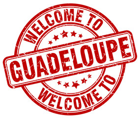 welcome to Guadeloupe red round vintage stamp