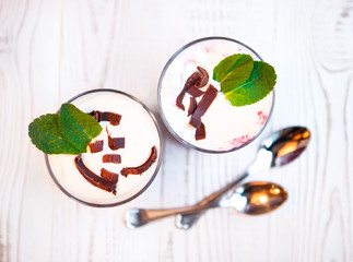 tasty dessert with bilberry cream and creamy mousse decorated wi