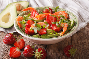 Cocktail salad with strawberries, avocado, shrimp and arugula. horizontal
