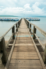 Wooden pier with Balinese boats near Taman Barrat National Park,
