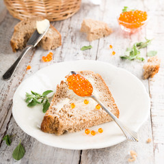 Open sandwich with red caviar