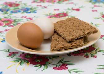Two chicken eggs with toast on a plate