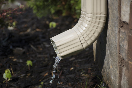 Gutter Downspout With Water - Side View