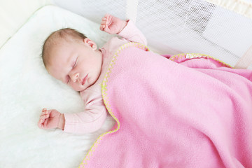 Sleeping 2-weeks newborn girl