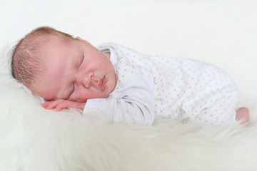 Newborn girl sleeps