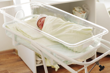 Fototapeta na wymiar Newborn baby girl in maternity hospital. 3 days