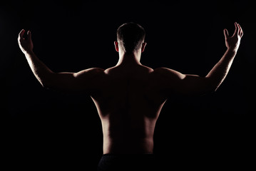 Back view of athletic man with bare torso