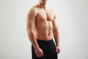 Fototapeta premium Muscular bare torso of athletic guy