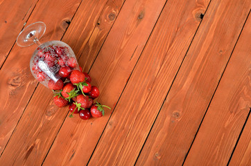 Mix fresh berries on a wooden table old. Luscious dessert close