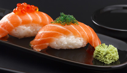 Sushi nigiri over black background