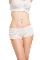 Fototapeta premium Unrecognizable woman in underwear with liposuction outlines