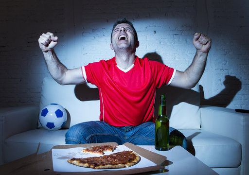 Fanatic Football Fan Man Watching Soccer Game On Tv Celebrating