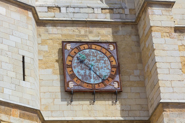Fototapeta na wymiar old clock on the wall aviles, Spain